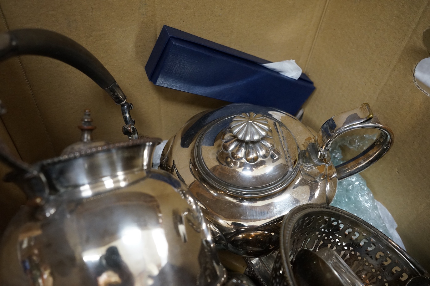 A group of assorted plated wares including an Old Sheffield plated tankard, tea kettle, teapot, flatware etc.